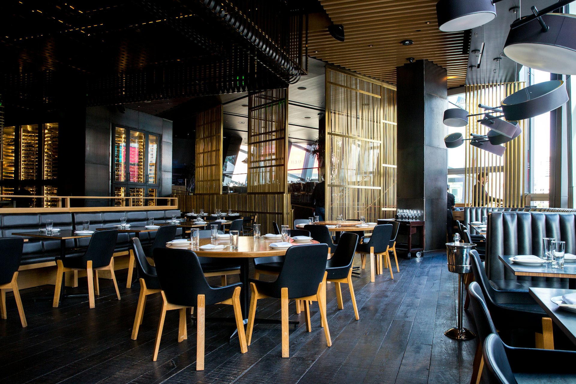 dark moody restaurant interior with warm lighting, modern design